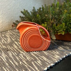 Fiesta creamer pitcher persimmon orange color. Vintage. No cracks. Mini disc.